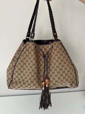 Gucci Peggy Beige Brown GG Canvas Drawstring Shoulder Bag with Tassels